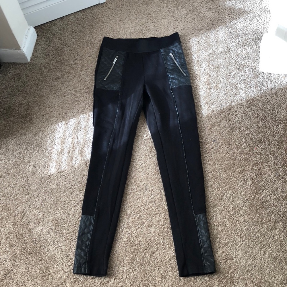Black leggings with leather and silver zippers
